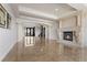 Open-concept living space with a fireplace, elegant floors, and a seamless flow at 73 Kittansett Loop, Henderson, NV 89052