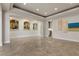 Expansive living area features arched openings and sleek marble floors, creating an inviting and open ambiance at 73 Kittansett Loop, Henderson, NV 89052