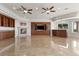 Comfortable living area with fireplace, custom built-ins, and tile floor at 73 Kittansett Loop, Henderson, NV 89052