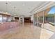 Open living room with a view to the pool area at 73 Kittansett Loop, Henderson, NV 89052