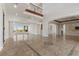Spacious living area with marble floors, architectural columns, and an abundance of natural light at 73 Kittansett Loop, Henderson, NV 89052