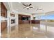 Elegant living room featuring a fireplace, built-in cabinetry, and tile flooring at 73 Kittansett Loop, Henderson, NV 89052
