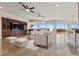 Bright living room with built-in cabinetry, ceiling fans, and a view at 73 Kittansett Loop, Henderson, NV 89052
