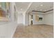 Open-concept living space with recessed lighting, travertine floors, and neutral wall colors at 73 Kittansett Loop, Henderson, NV 89052