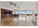 Expansive living room with built-in cabinetry, tile floors, and stunning views at 73 Kittansett Loop, Henderson, NV 89052