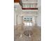 Bright living area with stone floors and fireplace, and views of the exterior at 73 Kittansett Loop, Henderson, NV 89052