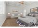 Spacious main bedroom featuring a ceiling fan and a cozy sitting area with natural light at 73 Kittansett Loop, Henderson, NV 89052