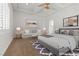 Spacious main bedroom featuring a ceiling fan and a cozy sitting area with natural light at 73 Kittansett Loop, Henderson, NV 89052