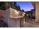 Modern outdoor kitchen equipped with grill, cabinetry, and brick accents at 73 Kittansett Loop, Henderson, NV 89052