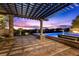 Outdoor patio featuring a pergola and pavers, ideal for entertaining and enjoying the sunset at 73 Kittansett Loop, Henderson, NV 89052