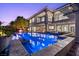The refreshing pool and spa are surrounded by lush landscaping and offer seamless indoor-outdoor living at 73 Kittansett Loop, Henderson, NV 89052