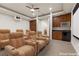 Home theater features large comfortable seating and kitchenette with microwave and mini-fridge at 73 Kittansett Loop, Henderson, NV 89052