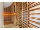 Spacious wine cellar featuring custom wooden shelving and ambient lighting at 73 Kittansett Loop, Henderson, NV 89052