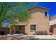 This backyard has a small lawn and a brick patio with outdoor seating and a built-in barbecue at 7733 Harthill Park Ave, Las Vegas, NV 89113