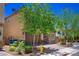 Charming two-story home features a two-car garage, stone accents, and a well-manicured front yard at 7733 Harthill Park Ave, Las Vegas, NV 89113