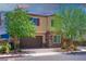 Charming two-story home features a two-car garage, stone accents, and a well-manicured front yard at 7733 Harthill Park Ave, Las Vegas, NV 89113