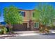 Charming two-story home features a two-car garage, stone accents, and a well-manicured front yard at 7733 Harthill Park Ave, Las Vegas, NV 89113