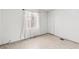 Bright bedroom with neutral walls, window with curtains and base molding at 805 E Carey Ave, North Las Vegas, NV 89030