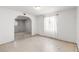 Empty room with white walls, light colored floor, and arched doorway at 805 E Carey Ave, North Las Vegas, NV 89030