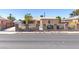 Charming single-story home featuring a secure brick and iron fence and well-maintained exterior at 805 E Carey Ave, North Las Vegas, NV 89030