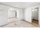 Bright living room with adjoining room featuring an arched doorway and an adjacent bathroom at 805 E Carey Ave, North Las Vegas, NV 89030