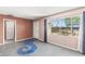 This is a view of the open living space with natural light, concrete floors, and a connected room at 805 E Carey Ave, North Las Vegas, NV 89030