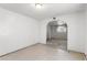 Spacious living room with arched doorway, light walls and flooring, ready for personalization at 805 E Carey Ave, North Las Vegas, NV 89030