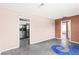 This is a view of the open living space with natural light, concrete floors, and a connected kitchen at 805 E Carey Ave, North Las Vegas, NV 89030