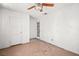 Room features a ceiling fan, a six-panel door and a nine-panel door with a glass window at 805 E Carey Ave, North Las Vegas, NV 89030