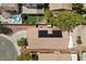 Aerial view of home with solar panels, a backyard pool, and mature trees at 8563 Red Diamond St, Las Vegas, NV 89123