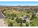 An aerial shot shows a park with play areas and baseball fields in the distance at 8563 Red Diamond St, Las Vegas, NV 89123