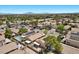 Aerial view of a residential community featuring well-maintained homes, some with solar panels and private pools at 8563 Red Diamond St, Las Vegas, NV 89123