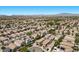 Wide aerial shot of a sprawling, planned desert community with well-maintained homes, desert landscaping, and solar panels at 8563 Red Diamond St, Las Vegas, NV 89123