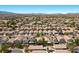 Panoramic aerial shot featuring closely knit neighborhood residences with desert mountain backdrop at 8563 Red Diamond St, Las Vegas, NV 89123