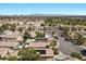 Aerial view of a well-planned community featuring homes with pools and solar panels in a suburban setting at 8563 Red Diamond St, Las Vegas, NV 89123