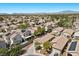 Modern residential area featuring solar panels, mature trees, and desert landscaping in a planned community at 8563 Red Diamond St, Las Vegas, NV 89123