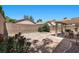 Beautiful low maintenance backyard with a covered patio and desert landscaping at 8563 Red Diamond St, Las Vegas, NV 89123