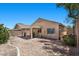 The backyard has a comfortable covered patio and low maintenance desert landscaping at 8563 Red Diamond St, Las Vegas, NV 89123