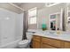 Bathroom featuring a tub, shower, and a vanity with a wood cabinet at 8563 Red Diamond St, Las Vegas, NV 89123