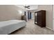 Well-lit bedroom featuring carpet, neutral walls, ceiling fan, and spacious closet space at 8563 Red Diamond St, Las Vegas, NV 89123