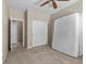 Bedroom features neutral walls, carpeted floors, a closet, and multiple doors for convenience at 8563 Red Diamond St, Las Vegas, NV 89123