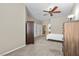 Spacious bedroom featuring neutral walls, ceiling fan, and closet with multiple doors at 8563 Red Diamond St, Las Vegas, NV 89123