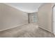 Carpeted bedroom with neutral paint, a window letting in natural light, and a closet at 8563 Red Diamond St, Las Vegas, NV 89123