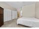 Bedroom with carpet, fan, and closet with views of ensuite bathroom at 8563 Red Diamond St, Las Vegas, NV 89123
