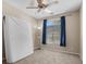Bedroom features neutral walls, carpeted floors, and ample natural light from a large window at 8563 Red Diamond St, Las Vegas, NV 89123