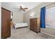 Bedroom with carpet, fan, and closet with views of ensuite bathroom at 8563 Red Diamond St, Las Vegas, NV 89123