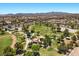 Community park with playground, green space, and walking paths in a residential neighborhood with mountain views at 8563 Red Diamond St, Las Vegas, NV 89123