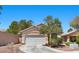 Charming single-story home with a two-car garage and desert landscaping at 8563 Red Diamond St, Las Vegas, NV 89123