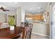Bright kitchen and breakfast nook features wood cabinetry, stainless appliances, and granite countertops at 8563 Red Diamond St, Las Vegas, NV 89123