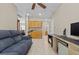 Living room with light-colored walls, tile floors, and access to other rooms at 8563 Red Diamond St, Las Vegas, NV 89123